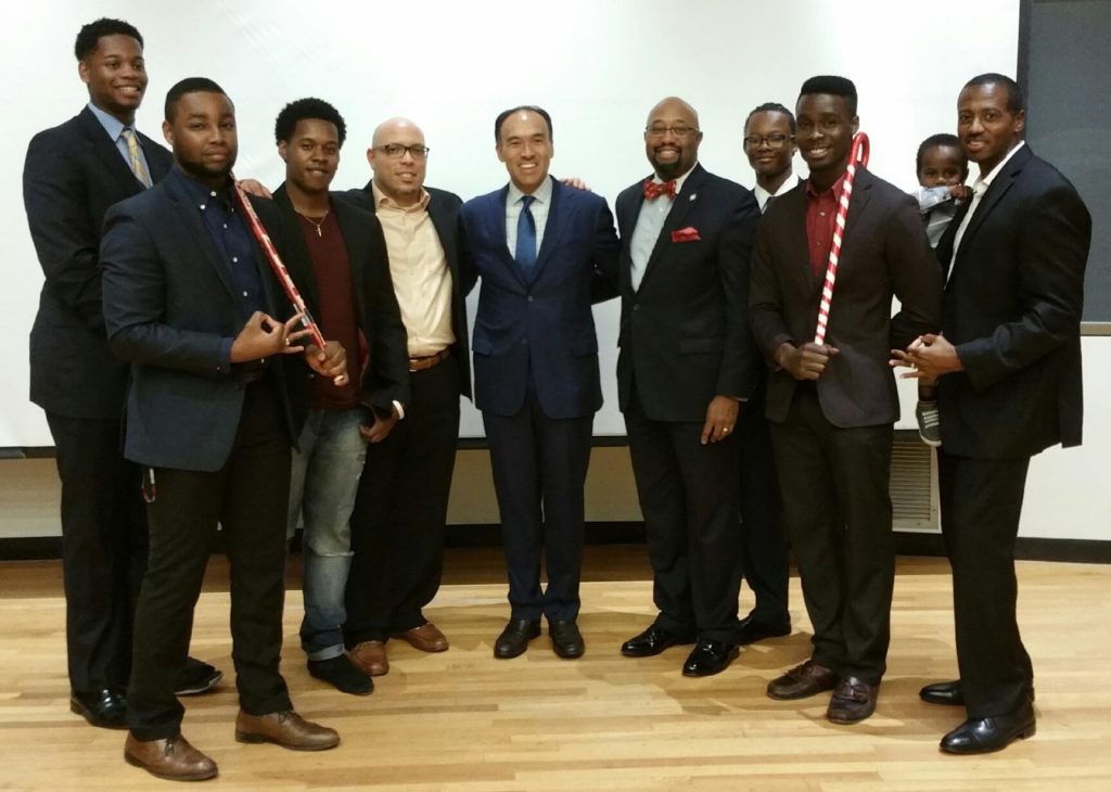 Deputy NBA Commission Mark Tatum (center) with members of Iota Phi Chapter.